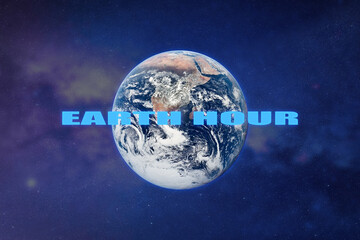 Earth planet in outer space with sign EARTH HOUR. Save the environment. Elements of this image...