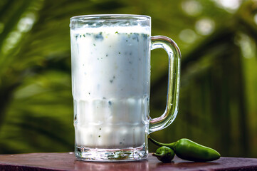 Buttermilk drink in glass cups closeup view.