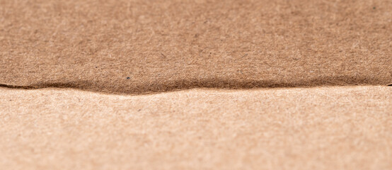 Old cardboard sheet of paper texture, brown background, paper sheet.