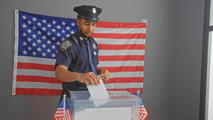 African american police officer voting at a ballot box with us flag in the background