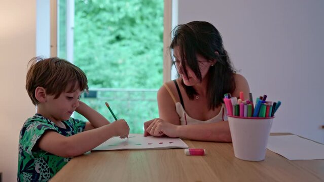 Mother And Little Boy In Homeschooling Moment - Doing Homework Connecting Dots