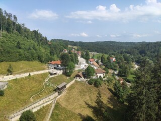 Village near Predjama Castle (Predjamski Grad) - Renaissance castle built within the Postojna Cave...