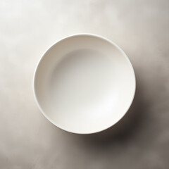 a simple white plate on the table. a place to place the product.