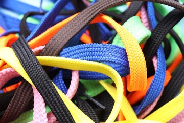Many colorful shoe laces as background, closeup