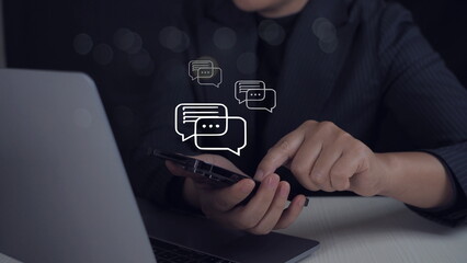 Person typing on mobile smart phone chatting conversation in chat box icon pop up for social media marketing technology. Live Chat Chatting on application.Sosial media chat concept.