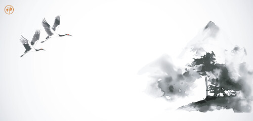 Ink wash painting of cranes flying over mountain. Traditional Japanese ink wash painting sumi-e. Hieroglyph - spirit