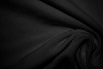 The black cloth background has soft curves. - obrazy, fototapety, plakaty