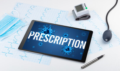 Tablet pc and doctor tools on white surface