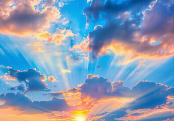 Beautiful sky with sun shining trough blue and yellow clouds