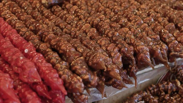 View of traditional sweets with churchkhela, sweet sausage, sujuk, dried fruits, walnuts and other sweets.
