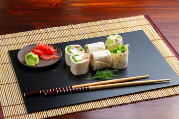 Sushi, Caesar rolls in pita bread. Lunch. Japanese food.