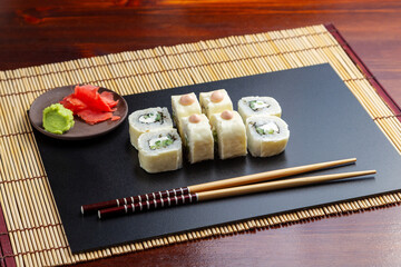 Sushi, rolls with melted cheese and cucumber. Lunch. Japanese food.