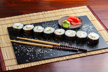 Sushi, maki rolls with salmon, cheese and cucumber. Lunch. Japanese food.
