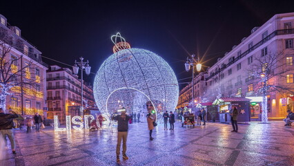 Panorama showing Christmas decorations with big ball on Luis De Camoes square night timelapse.