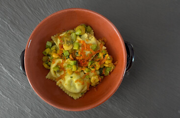 Italian ricotta-flavoured ravioli with bottarga, courgettes and prawns