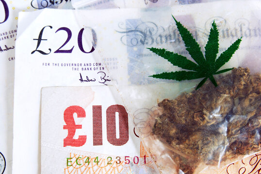 Soft drugs business. Bag of Thai weed with UK pound banknotes.