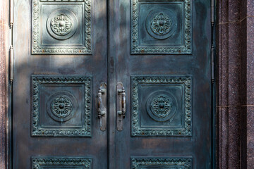 Antique heavy brass doors for the entrance to the house.