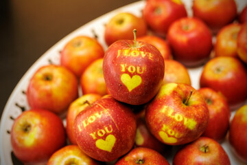 Apples set with I LOVE YOU text.