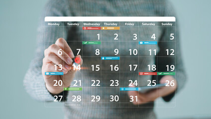 Businessman sets a calendar to mark target dates on colored paper. Appointment reminder calendar...