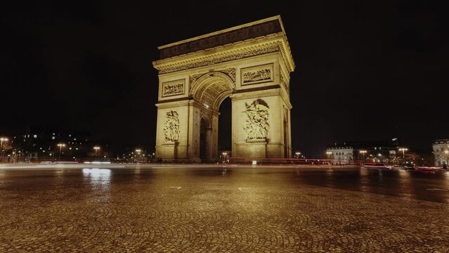 Arc de Triomphe with traffic light trails at night in Paris, Time lapse