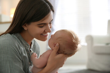 Mother with her newborn baby at home