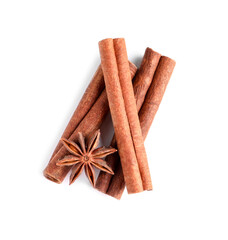 Cinnamon sticks and anise star isolated on white, top view
