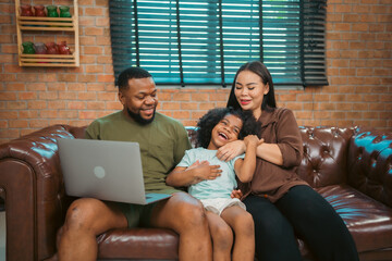 Smiling African-American father shares fun and love with his cheerful children at home, celebrating family with childhood together, African American black person in happy together of father's day - 765031564