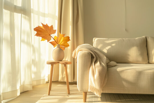 Interior design of living room with copy space, beige sofa, side table, leaf in vase.