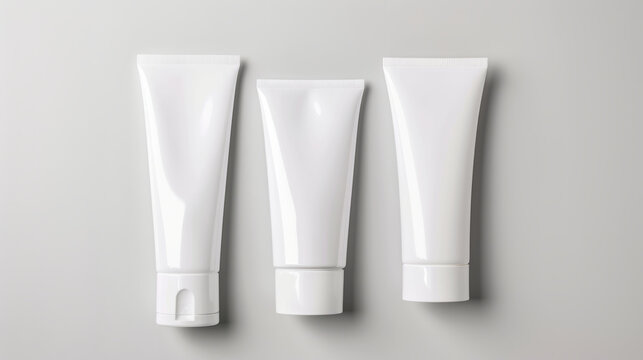 Sleek Product Packaging. Mockup of White Cosmetic Tubes on Neutral Background for branding.