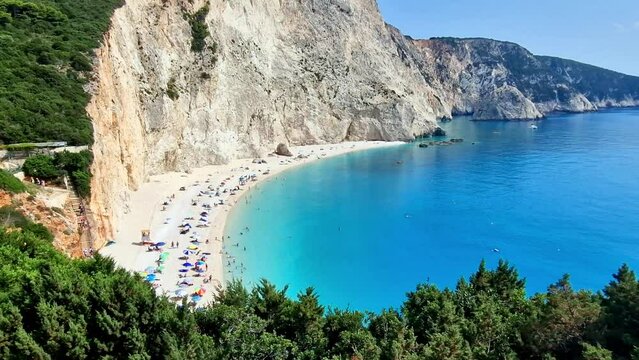 Aerial view of Porto Katsiki beach with white cliffs and turquoise water, Lefkada, Greece. Drone footage of Ionian sea coastline.