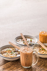 Breakfast Steamed bread with colourful thai custard and Vietnamese Rice Noodles Soup,thai tea drink.