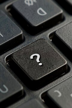 Question mark on computer keyboard. Conceptual image of question mark.