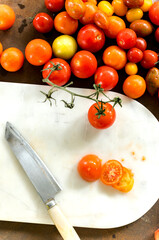 Slice tomatoes for cook on marble cutting board