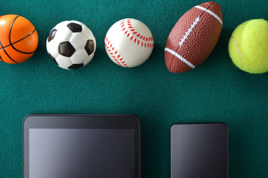 Concept of sports events and technology with devices and balls