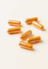 Coenzyme Q10 capsules. Dietary supplements. Bright paper background. 