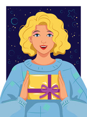Happily smiling curly blonde girl in blue oversized hand-knit retro sweater holding a yellow giftbox