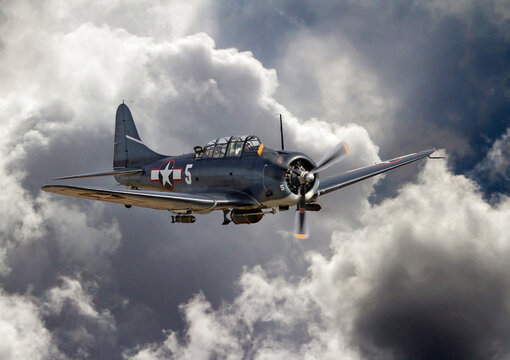 Douglas SBD Dauntless Dive Bomber in Flight with Threatening Clouds
