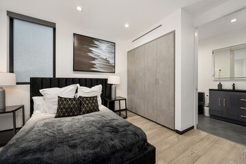 Modern apartment bedroom with spacious bed and two bedside tables