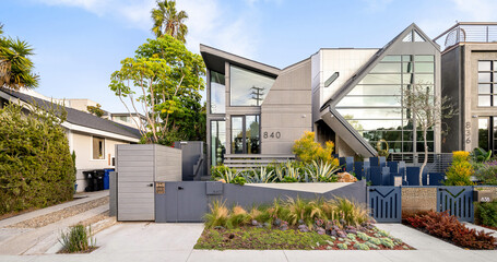 Beautiful modern house exterior with lush green plants in Venice Beach, California