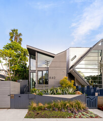 Fototapeta na wymiar Beautiful modern house exterior with lush green plants in Venice Beach, California