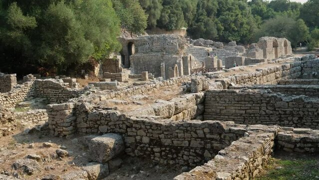 Ruins of Great Basilica in Butrint National Park, Buthrotum, Albania. Triconch Palace at Butrint Life and death of an ancient Roman house Historical medieval Venetian Tower surrounded. Butrint