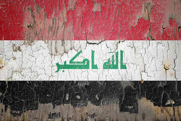 Iraq flag painted on the cracked wall