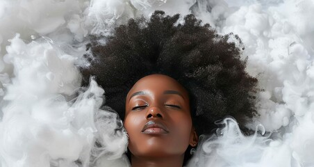 Black woman laying in clouds, top view