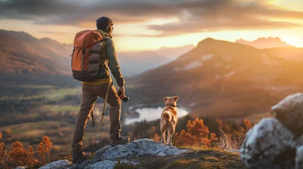 Gordijnen A hiker, a young man and his dog, hiking in beautiful rocky European Alps mountain landscape with a trekking backpack. A man hiking in the sunrise time. © Natalia Schuchardt