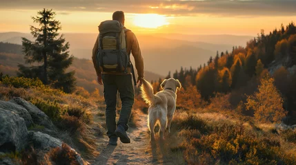 Gardinen A hiker, a young man and his dog, hiking in beautiful rocky European Alps mountain landscape with a trekking backpack. A man hiking in the sunrise time. © Natalia Schuchardt