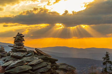 Stone cairns at sunset (Skalny Stół) in summer with a view of Śnieżka and the entire Karkonosze
