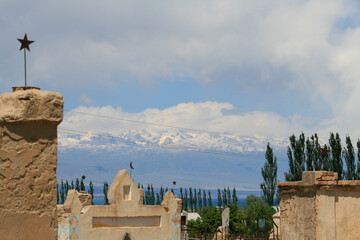 Grave yard at the shores of Issyk-Kul and Tian Shan Mountains, Kyrgyzstan