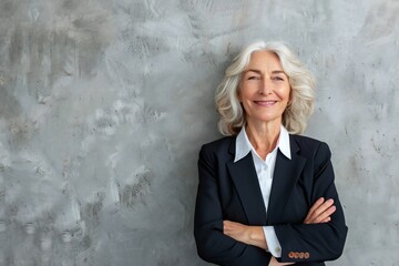 Happy Senior woman, arms crossed in portrait and corporate professional with smile, pride and job satisfaction on wall background. Manager, confident  realtor with ambition and happy in career