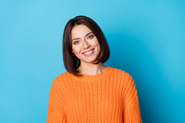 Portrait of attractive cheerful funny brunette girl wearing warm jumper wintertime isolated over...