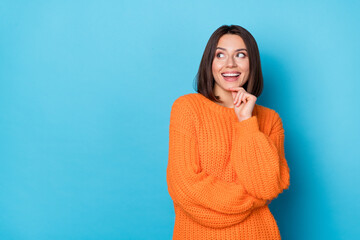 Portrait of attractive funny cheerful girl making decision copy empty blank space isolated over bright blue color background - 765097143